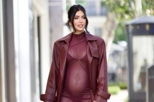 Pregnant Megan Fox flaunts  her bump in sheer dress as she prepares to welcome first child with rapper MGK (Photos)