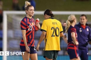 Kristie Mewis and Sam Kerr following a match between the USA and Australia in 2021