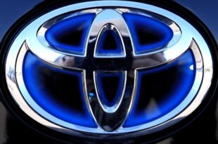 Scandal-hit car maker Toyota sees profits take a tumble