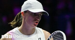 Iga Swiatek reacts during a match at the 2024 WTA Finals