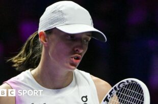 Iga Swiatek reacts during a match at the 2024 WTA Finals