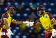 Evin Lewis and Shai Hope bump fists during their partnership of 136 v England