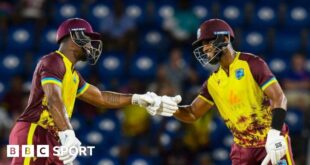 Evin Lewis and Shai Hope bump fists during their partnership of 136 v England