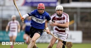 Slaughtneil's Paul McNeill battles with Sarsfields' Daniel Kearney in Newbridge