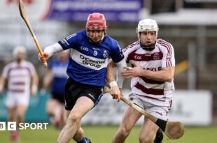 Slaughtneil's Paul McNeill battles with Sarsfields' Daniel Kearney in Newbridge