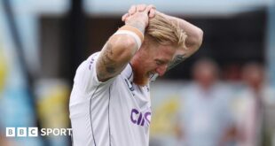 England captain Ben Stokes puts his hands on his head as he leaves the field injured