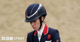 Charlotte Dujardin wearing a helmet