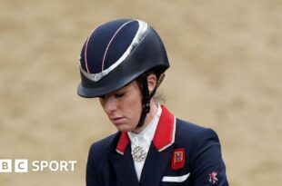 Charlotte Dujardin wearing a helmet