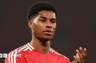 Manchester United forward Marcus Rashford claps fans