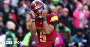 Washington quarterback Jayden Daniels celebrates victory