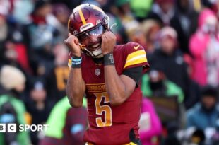 Washington quarterback Jayden Daniels celebrates victory