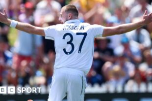 Gus Atkinson celebrates taking a hat-trick against New Zealand