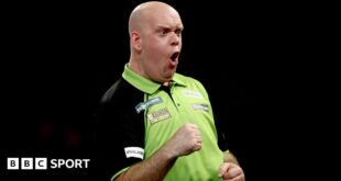 Michael van Gerwen shouts after winning a leg at the World Darts Championship