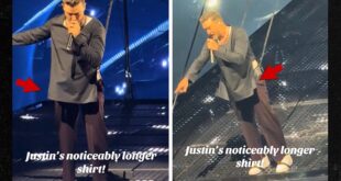 Singer Justin Timberlake covers up in longer shirt onstage after bulge went viral