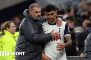 Tottenham manager Ange Postecoglou with defender Cristian Romero