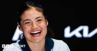 Emma Raducanu laughs during her pre-tournament news conference at the 2025 Australian Open