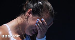 An emotional Jodie Burrage covers her face after beating Leolia Jeanjean in the Australian Open first round