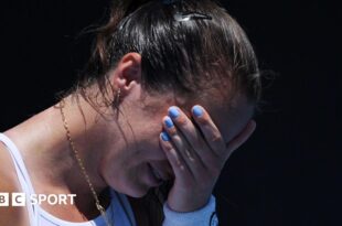 An emotional Jodie Burrage covers her face after beating Leolia Jeanjean in the Australian Open first round