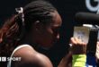 A message reading 'Stay strong LA, thank you firefighters' written on a camera lens by Coco Gauff at the Australian Open