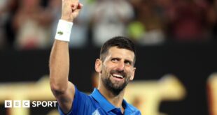 Novak Djokovic cups his ear to the Melbourne crowd