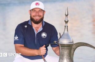 Tyrrell Hatton with the winners trophy