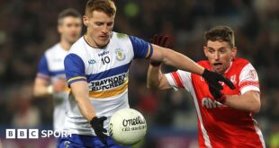 Peter Harte attempts to get in a shot at Croke Park despite the efforts of Cuala's Luke Keating