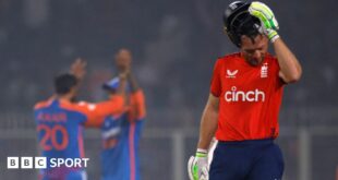 England captain Jos Buttler removes his helmet as he walks off after being dismissed