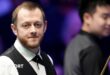 Mark Allen smiles during his Masters match against Si Jiahui