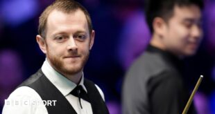 Mark Allen smiles during his Masters match against Si Jiahui