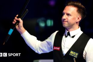 Judd Trump celebrates his quarter-final win at the Masters