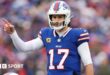 Buffalo Bills quarterback Josh Allen points to his team-mate during their Wildcard Weekend game agains the Denver Broncos