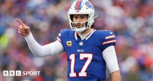 Buffalo Bills quarterback Josh Allen points to his team-mate during their Wildcard Weekend game agains the Denver Broncos