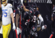 Houston Texans' Eric Murray celebrates after returning an interception for a touchdown against the Los Angeles Chargers