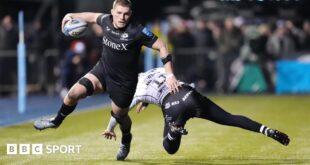 Tom Willis runs past a tackler to score a try