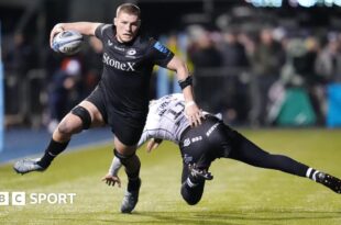 Tom Willis runs past a tackler to score a try