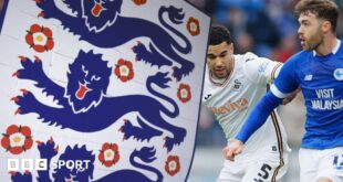 FA badge crest alongside Ben Cabango of Swansea City and Calum Chambers of Cardiff City