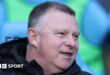 Mark Robins sitting in the dugout during his time as Coventry City boss