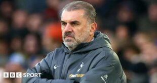 Ange Postecoglou wearing a Tottenham coat