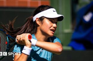 Emma Raducanu hits a return during practice in Indian Wells